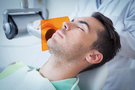 man sleeping during a dental procedure