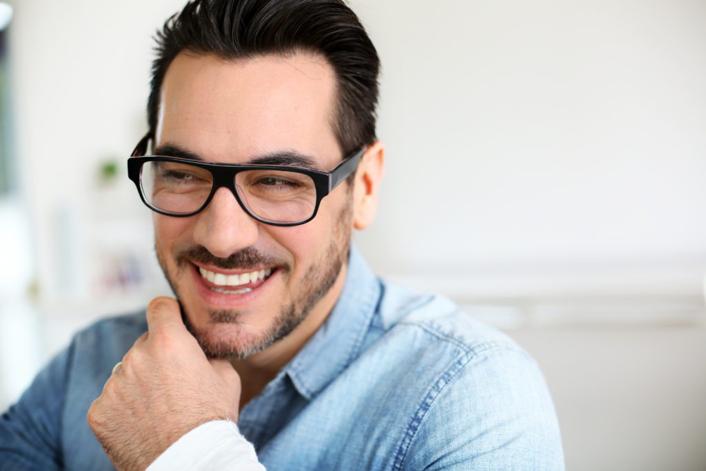 man smiling after getting his teeth whitened at Gillespie Dentistry