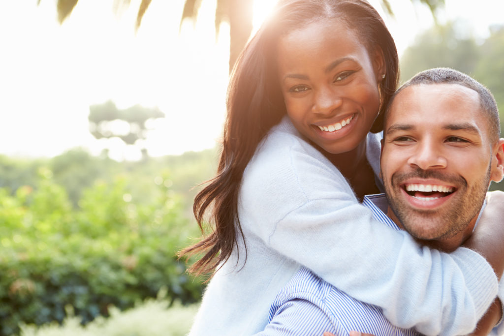 couple smiling after getting their teeth whitened